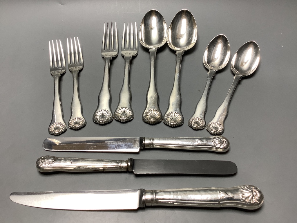 Seven items of George IV silver shell pattern flatware, William M. Traies, London, 1829, one other similar dessert fork and three silver handled knives, weighable silver 19.5 oz.